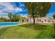 Inviting backyard showcasing a sparkling pool, lush greenery, and a relaxing outdoor space at 10130 E San Salvador Dr, Scottsdale, AZ 85258