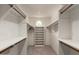 Organized walk-in closet with custom shelving and natural light at 10130 E San Salvador Dr, Scottsdale, AZ 85258