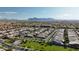 Expansive aerial view of the neighborhood, highlighting the lush landscaping and mountain views at 10428 E Nopal Ave, Mesa, AZ 85209