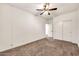 Bedroom featuring neutral walls and carpet, a ceiling fan, and a closet at 10428 E Nopal Ave, Mesa, AZ 85209