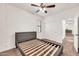 Bedroom featuring neutral walls and carpet, a ceiling fan, closet, and a window at 10428 E Nopal Ave, Mesa, AZ 85209
