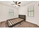 Bedroom featuring neutral walls and carpet, a ceiling fan, and a window at 10428 E Nopal Ave, Mesa, AZ 85209