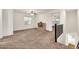 Spacious bonus room with a window, neutral carpet, and staircase access at 10428 E Nopal Ave, Mesa, AZ 85209