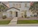 Inviting two-story home featuring a stucco facade, manicured landscaping and covered front porch entry at 10428 E Nopal Ave, Mesa, AZ 85209