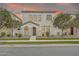 Inviting two-story home featuring a stucco facade, manicured landscaping and covered front porch entry at 10428 E Nopal Ave, Mesa, AZ 85209