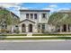Inviting two-story home featuring a stucco facade, manicured landscaping and covered front porch entry at 10428 E Nopal Ave, Mesa, AZ 85209