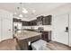Stylish kitchen with a central island, granite counters, stainless appliances, and modern cabinetry at 10428 E Nopal Ave, Mesa, AZ 85209