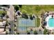 Aerial view showcasing the community tennis courts, meticulously maintained, with parking and landscaping at 10428 E Nopal Ave, Mesa, AZ 85209