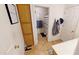 Hallway bathroom with tiled floor, built in storage, and a shower/tub combo at 10441 W Windsor Ave, Avondale, AZ 85392