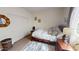 Bright bedroom with a neutral color palette, a plush bed, and a walk-in closet at 10441 W Windsor Ave, Avondale, AZ 85392