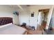 Bedroom with hardwood flooring, neutral walls, and a double door closet at 10441 W Windsor Ave, Avondale, AZ 85392