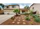 Lovely two-story home with desert landscaping, stone pathway, and covered front porch at 10441 W Windsor Ave, Avondale, AZ 85392