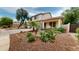Inviting two-story home with desert landscaping and a stone walkway to the porch at 10441 W Windsor Ave, Avondale, AZ 85392