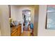 Hallway with view into the living room featuring wood floor and light colored walls at 10441 W Windsor Ave, Avondale, AZ 85392
