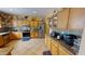 Modern kitchen with stainless steel appliances, custom cabinets, and granite countertops at 10441 W Windsor Ave, Avondale, AZ 85392