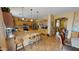 Expansive kitchen with breakfast bar seating, wooden cabinets, and modern appliances at 10441 W Windsor Ave, Avondale, AZ 85392