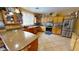 Well-lit kitchen boasts stainless steel appliances, granite countertops, and ample cabinet space at 10441 W Windsor Ave, Avondale, AZ 85392