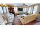 Bright and inviting living room with hardwood floors, modern decor, and ample natural light at 10441 W Windsor Ave, Avondale, AZ 85392