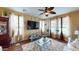 Comfortable living room with large TV, stylish decor, and plenty of natural light at 10441 W Windsor Ave, Avondale, AZ 85392