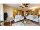 Bright living room featuring white sofas, plush rug and elegant decor at 10441 W Windsor Ave, Avondale, AZ 85392