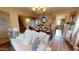 Elegant living room with hardwood floors, chandelier, and dining area in view at 10441 W Windsor Ave, Avondale, AZ 85392