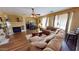 Comfortable living room featuring a fireplace, ample seating, and hardwood floors at 10441 W Windsor Ave, Avondale, AZ 85392