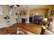 Cozy living room with fireplace and entertainment center, ideal for relaxation at 10441 W Windsor Ave, Avondale, AZ 85392