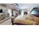 Large main bedroom boasts a large bed and ample space with bright, natural lighting at 10441 W Windsor Ave, Avondale, AZ 85392