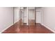 Large mirrored closet doors in this bedroom with hardwood floors, offer both style and ample storage space at 1173 E Cochise Dr, Phoenix, AZ 85020