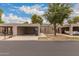 Beige single-story home featuring carports and desert landscaping at 1173 E Cochise Dr, Phoenix, AZ 85020