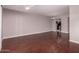 Expansive living room featuring gleaming hardwood floors and a ceiling fan at 1173 E Cochise Dr, Phoenix, AZ 85020