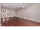 Hardwood floored living room with bright lighting and sliding doors to the backyard at 1173 E Cochise Dr, Phoenix, AZ 85020