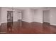 Open living room features hardwood floors and access to other rooms at 1173 E Cochise Dr, Phoenix, AZ 85020