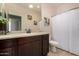 Bathroom with cream colored walls and vanity with a mirror and overhead lighting at 1223 E Palo Verde Dr, Casa Grande, AZ 85122