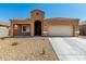 Charming single-story home featuring a tile roof, low-maintenance landscaping, and attached two-car garage at 1223 E Palo Verde Dr, Casa Grande, AZ 85122