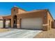 Attractive single-story home boasting a tile roof, desert landscaping, and attached two-car garage at 1223 E Palo Verde Dr, Casa Grande, AZ 85122