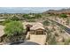 Beautiful home with landscaped front yard in a desert community, nestled among trees and desert vegetation at 12448 N 129Th Pl, Scottsdale, AZ 85259
