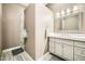 Bathroom featuring a spacious vanity with bright vanity lighting and a framed mirror above at 12448 N 129Th Pl, Scottsdale, AZ 85259