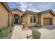 Inviting front entrance with well-maintained landscaping and decorative front door at 12448 N 129Th Pl, Scottsdale, AZ 85259