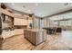 Open kitchen featuring granite countertops, stainless steel appliances, and wood-look tile flooring at 12448 N 129Th Pl, Scottsdale, AZ 85259