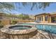 Beautiful pool and spa area with landscaped surroundings, perfect for relaxing outdoors at 12448 N 129Th Pl, Scottsdale, AZ 85259