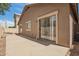 Backyard with a concrete patio, stucco wall and rock landscaping at 125 N 22Nd Pl # 53, Mesa, AZ 85213
