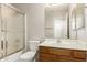 Bathroom featuring a shower, toilet, sink and a mirror at 125 N 22Nd Pl # 53, Mesa, AZ 85213