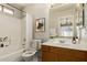 Clean bathroom featuring tile surround shower and wood vanity at 125 N 22Nd Pl # 53, Mesa, AZ 85213