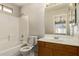 Clean bathroom featuring a shower-tub combination and a vanity with a wood cabinet at 125 N 22Nd Pl # 53, Mesa, AZ 85213