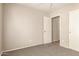 Bedroom featuring a ceiling fan, carpet, and closet at 125 N 22Nd Pl # 53, Mesa, AZ 85213