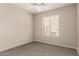 Neutral bedroom featuring a ceiling fan, one window and carpet at 125 N 22Nd Pl # 53, Mesa, AZ 85213