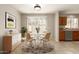 Bright dining area with stylish table, chairs, and natural light near kitchen at 125 N 22Nd Pl # 53, Mesa, AZ 85213