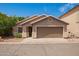 Charming single-story home with a well-maintained yard and a welcoming facade at 125 N 22Nd Pl # 53, Mesa, AZ 85213