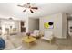 Cozy living room featuring tile flooring, ceiling fan, neutral decor, and bright light at 125 N 22Nd Pl # 53, Mesa, AZ 85213